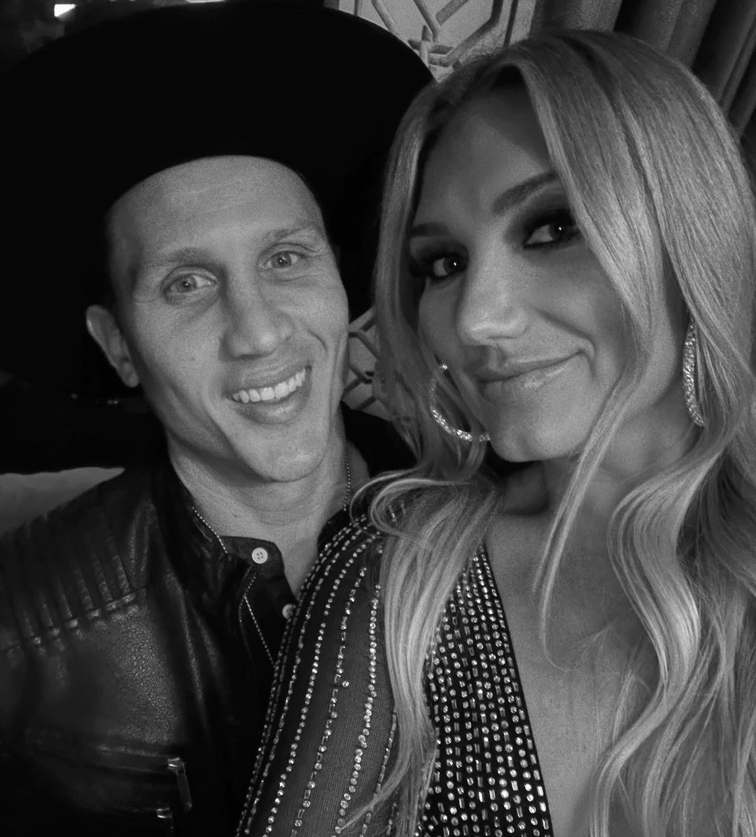 Brooke Hogan, the daughter of wrestling legend Hulk Hogan, has publicly confirmed that she got married in June 2022 to hockey player Steven Olesky. The couple tied the knot in a private ceremony in Orlando, Florida, with no guests present. The couple’s meeting and relationship Brooke and Steven met and started dating, eventually leading to their secret wedding in 2022. The couple has managed to keep their relationship private, only sharing rare glimpses of their life together on social media. The wedding ceremony Brooke and Steven exchanged vows in a private ceremony in Orlando, Florida, on June 8, 2022. The couple chose to keep their nuptials private for over a year before publicly confirming their marriage. Brooke Hogan’s career Brooke is a singer and has worked in the wrestling industry, including TNA from 2012 to 2013 while her father was there. Her career has allowed her to maintain a low profile, which may have contributed to the secrecy surrounding her marriage. Steven Olesky’s career Steven is a hockey player, which may have played a role in the couple’s decision to keep their relationship private. His career in a sport with a strong fan base could have led to increased attention and scrutiny, prompting the couple to maintain their privacy. The couple’s public confirmation Brooke confirmed her marriage to Steven on her Instagram account, sharing a photo of her husband and expressing her gratitude for the kind words and support from fans. The couple’s public confirmation of their marriage has allowed them to share their happiness with their fans while still maintaining their privacy. Conclusion Brooke’s marriage to Steven Olesky has been a private affair, with the couple choosing to keep their relationship and nuptials out of the public eye. Their careers in the entertainment and sports industries may have contributed to their decision to maintain their privacy, allowing them to enjoy their marriage without the constant scrutiny of the media. 